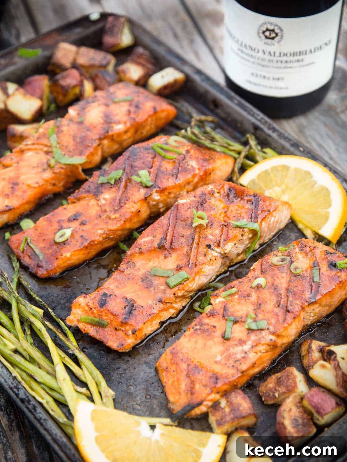 Grilled Salmon Dinner: 3-Course Menu with Sides and Dessert 2 Grilled salmon filets on a pan.