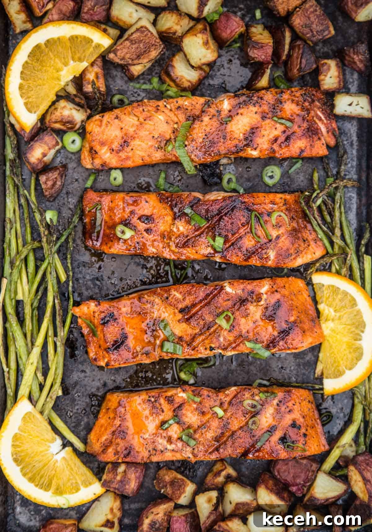 Grilled Salmon Dinner: 3-Course Menu with Sides and Dessert 4 Grilled salmon with maple glaze on sheet pan.