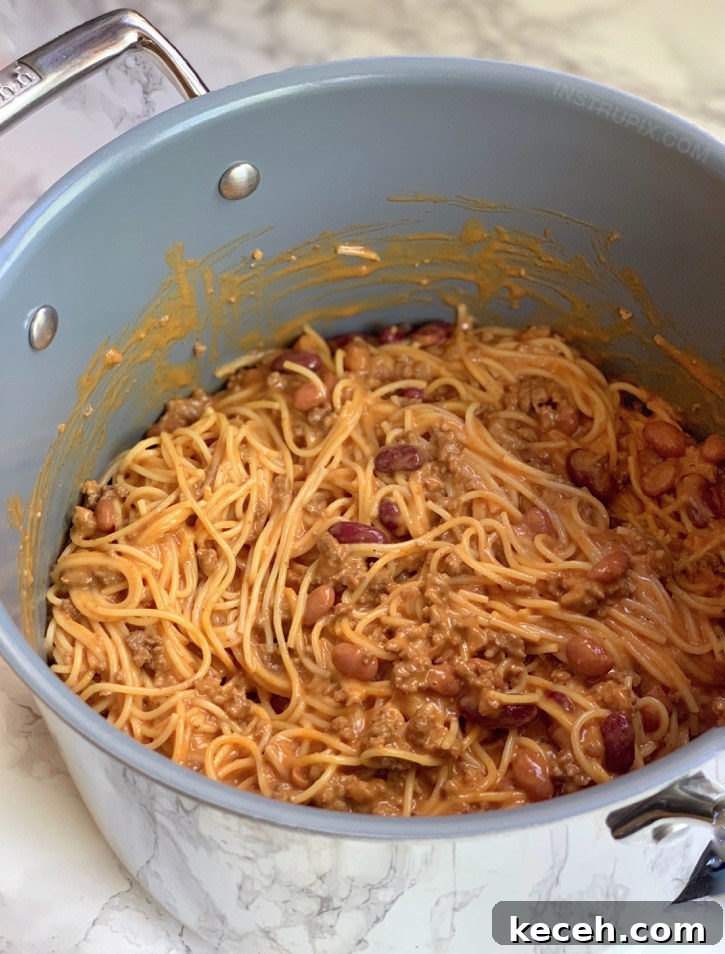 Cheesy Taco Spaghetti Casserole - Looking for quick and easy dinner ideas made with ground beef? This Mexican casserole recipe is made with cheap and simple ingredients! It's perfect for the family. Kids love it! The ultimate comfort food for busy weeknights. | Instrupix 