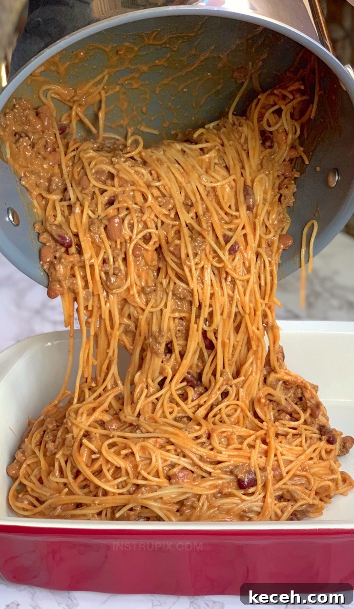 Cheesy Taco Spaghetti Casserole - Looking for quick and easy dinner ideas made with ground beef? This Mexican casserole recipe is made with cheap and simple ingredients! It's perfect for the family. Kids love it! The ultimate comfort food for busy weeknights. | Instrupix #instrupix #dinnerrecipes #dinnercasseroles #bakedspaghetti 