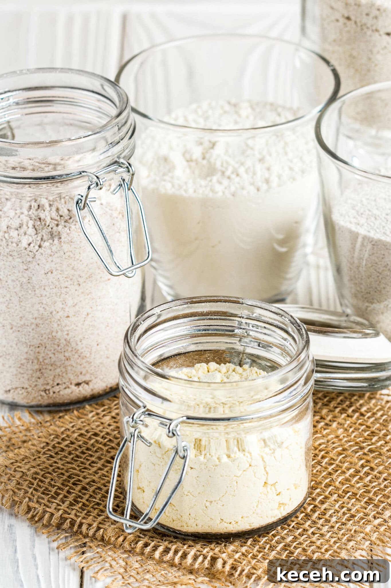 Different  low carb flour in glass jars, almond, coconut