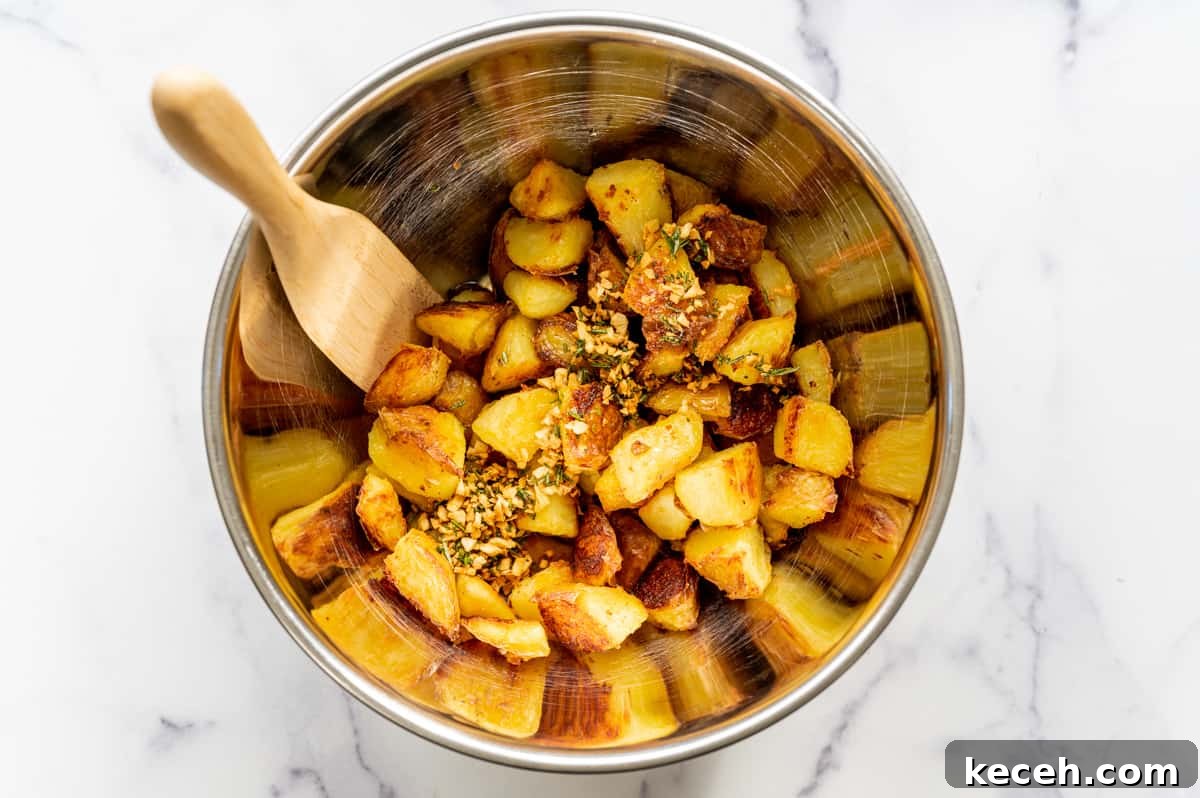 Crispy Rosemary Roasted Potatoes Recipe 12 toasted garlic and rosemary mixture on roasted potatoes