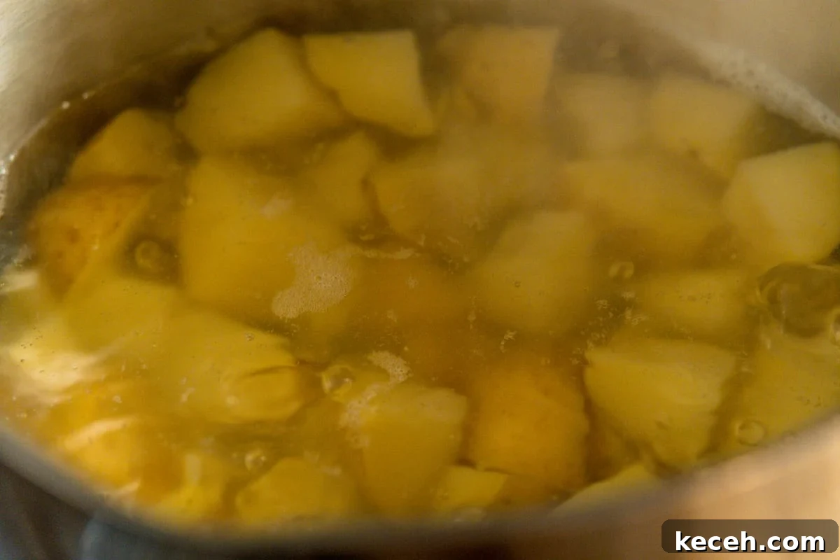 Crispy Rosemary Roasted Potatoes Recipe 5 parboiling cubed potatoes.