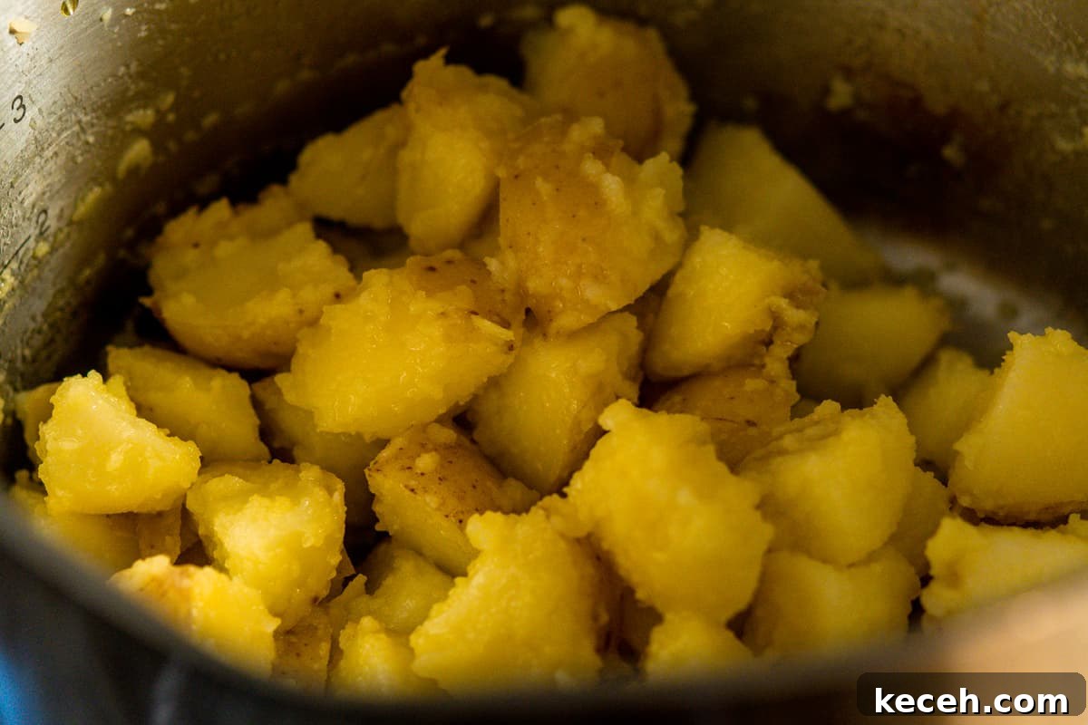 Crispy Rosemary Roasted Potatoes Recipe 7 fuzzy potatoes tossed with olive oil.