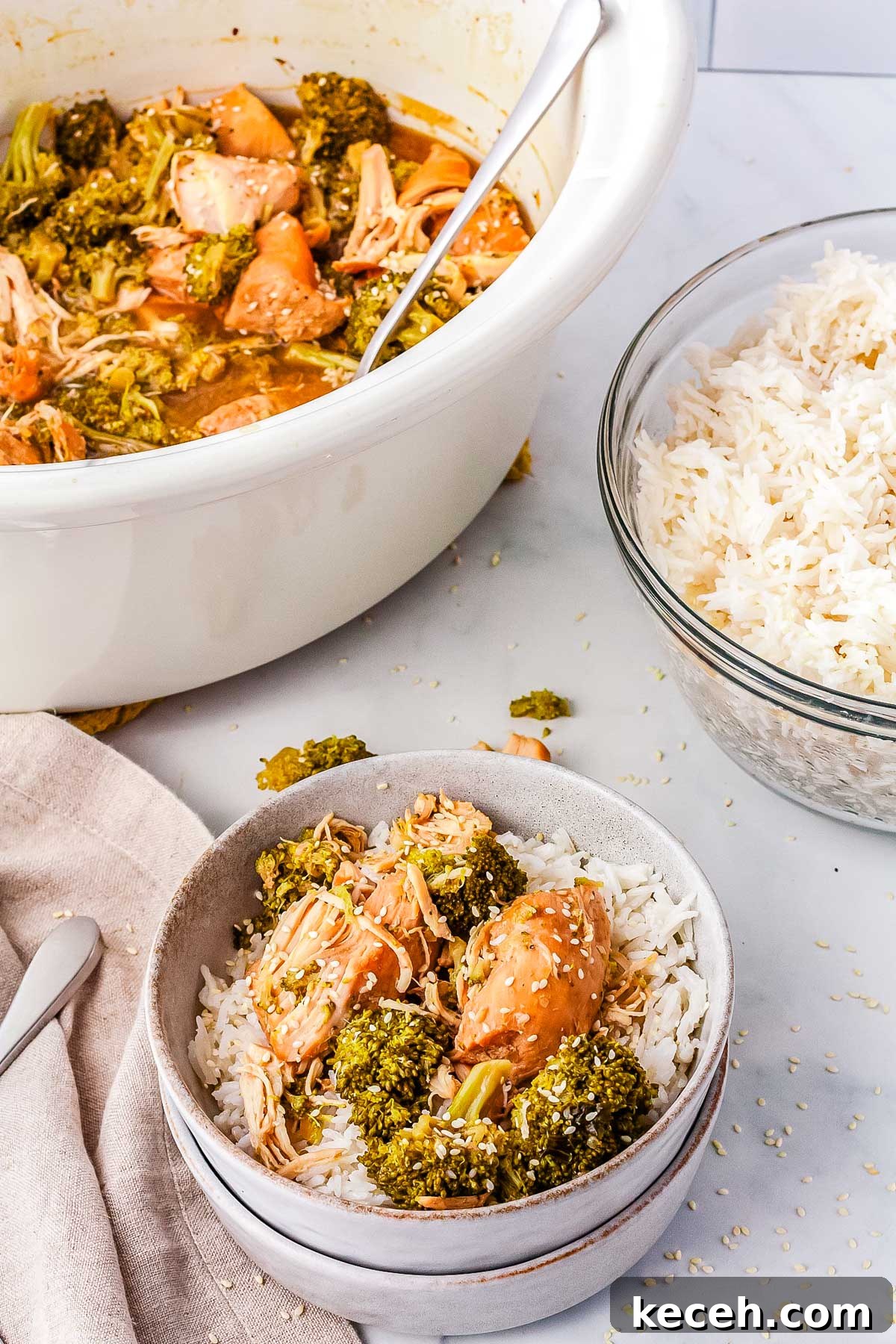 Slow Cooker Chicken and Broccoli Dinner 8 A bowl of chicken and broccoli served over rice.
