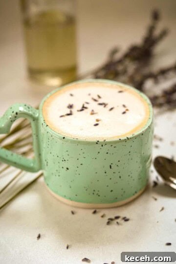hot lavender latte in blue speckled coffee mug