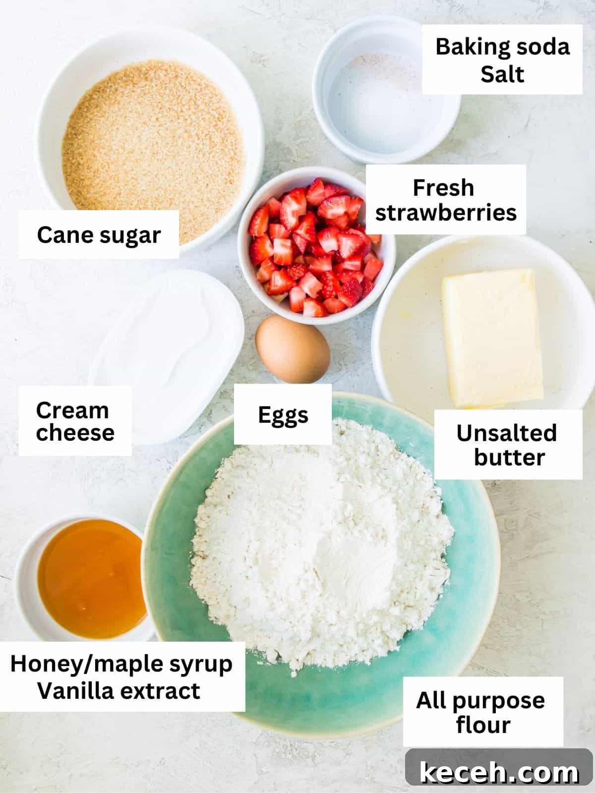 The ingredients needed to make strawberry cheesecake cookies separated into small bowls. 