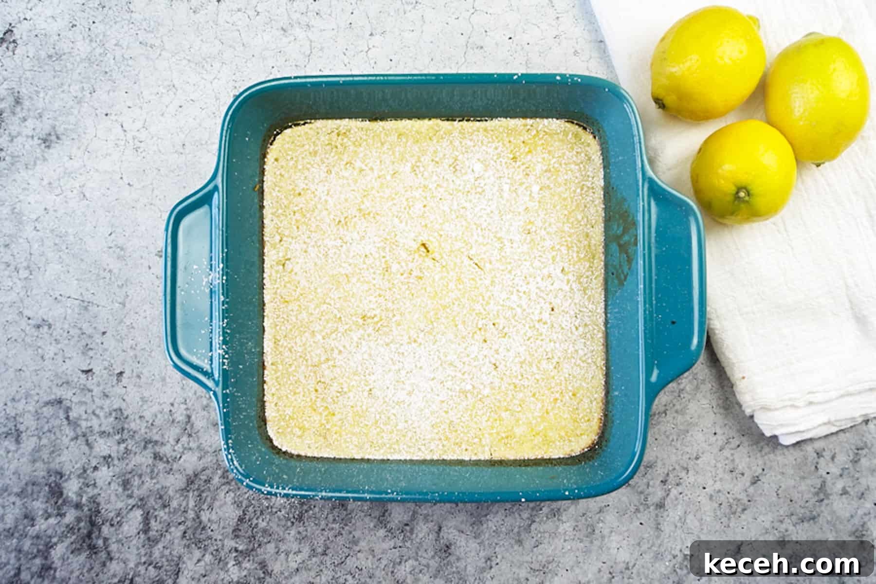 Classic Old-Fashioned Lemon Squares Recipe for Bright Dessert 9 lemon bars after baking with powdered sugar on top.