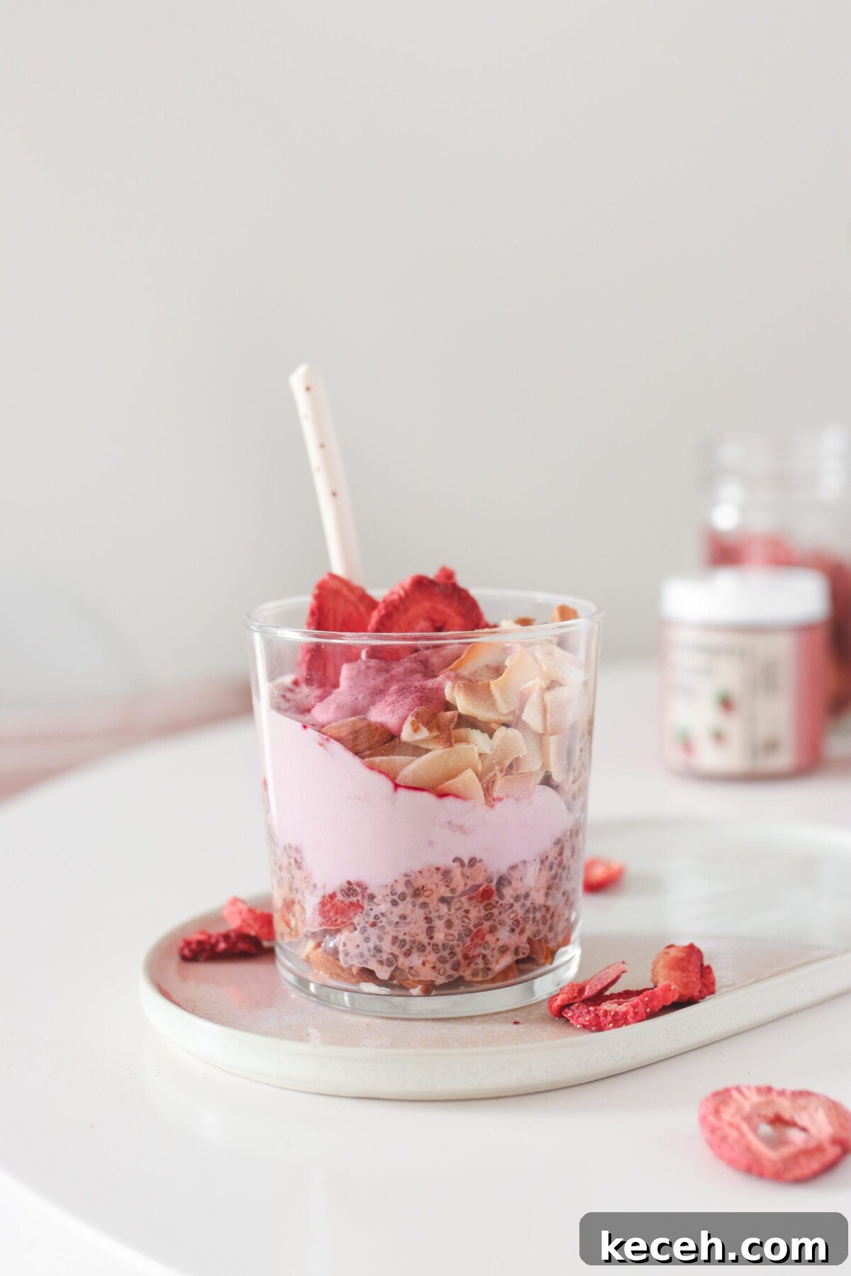 Strawberry Shortcake Overnight Oats Recipe – Make Ahead Breakfast 3 overnight oats with strawberries and other toppings in a glass jar with a spoon