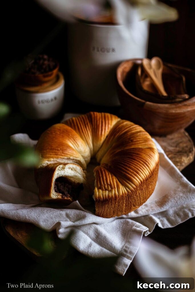 Top angle view of wool bread peaking through some foliage.