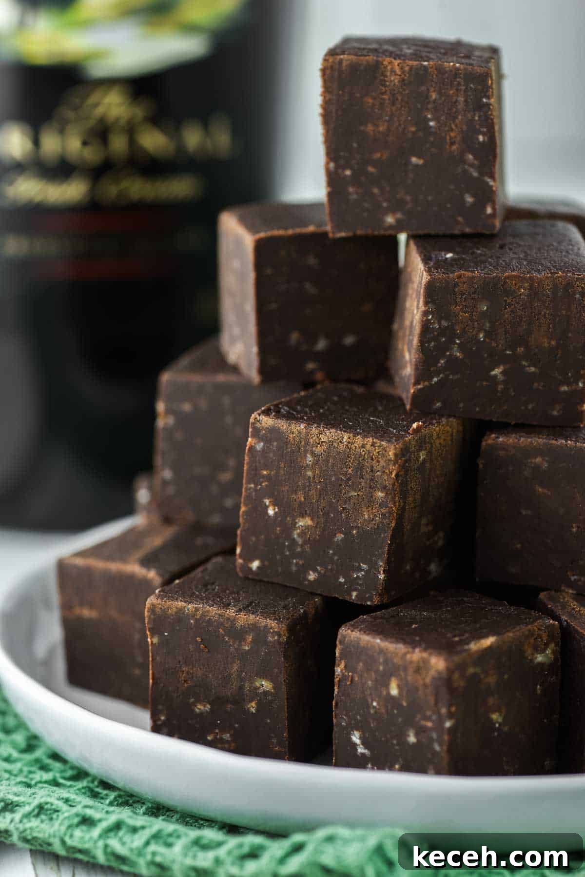 Decadent Baileys Chocolate Fudge Recipe 8 Stacked Baileys fudge on plate.