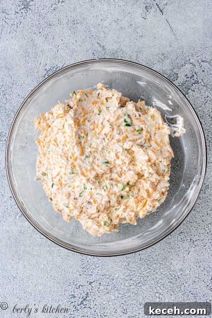 Spicy Jalapeño Cheese Ball Recipe for Parties 4 The ingredients have been combined in the bowl.
