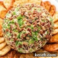 Spicy Jalapeño Cheese Ball Recipe for Parties 7 An aerial view of the jalapeno cheese ball with crackers.