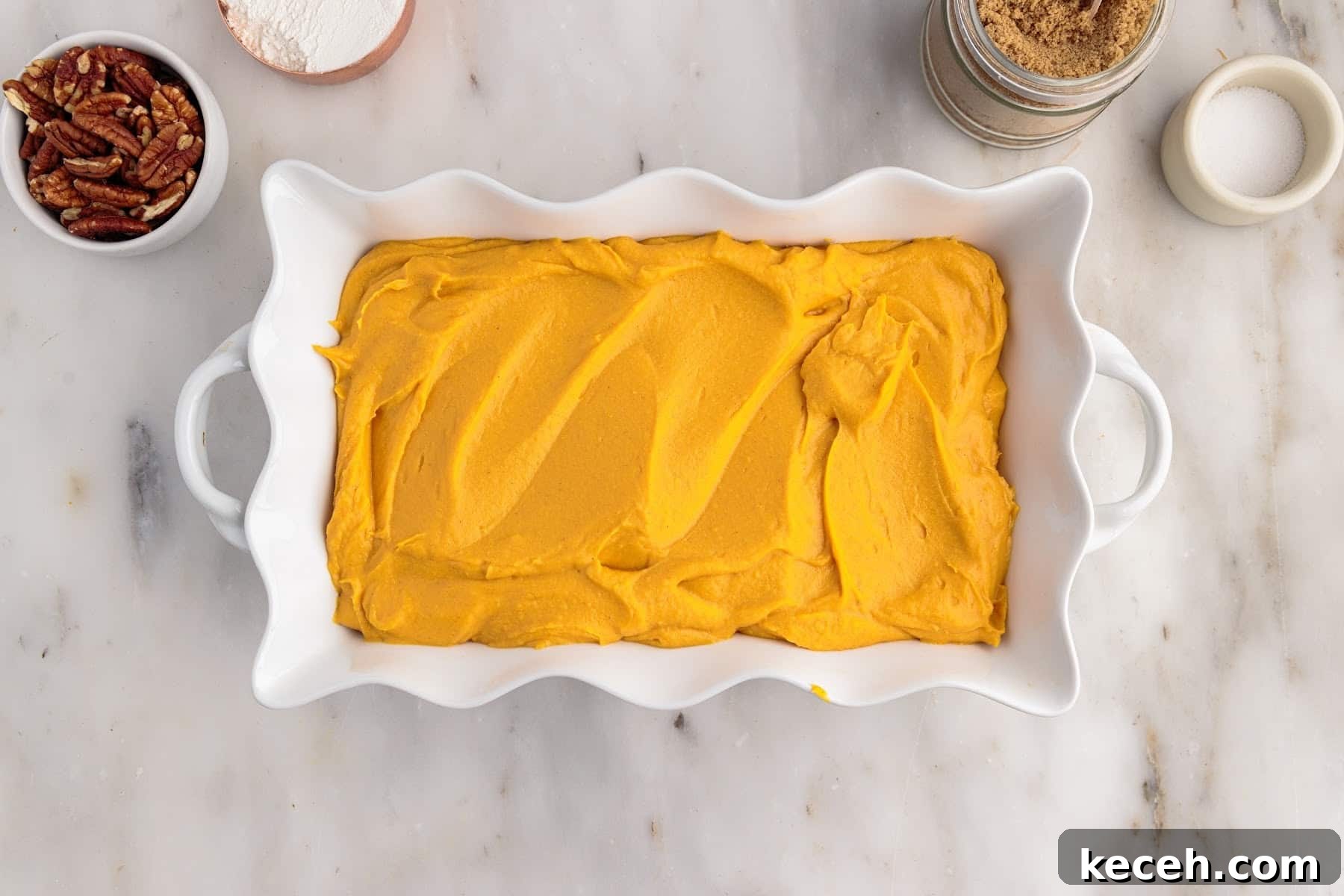 Irresistible Sweet Potato Soufflé Recipe for Holiday Desserts 7 Sweet Potato Souffle in a decorative baking dish before baking.