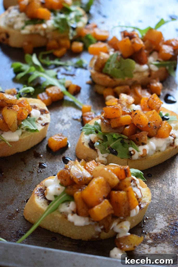 Roasted Butternut Squash & Apple Bruschetta Recipe for Fall Entertaining 4 roasted squash bruschetta on a baking tray