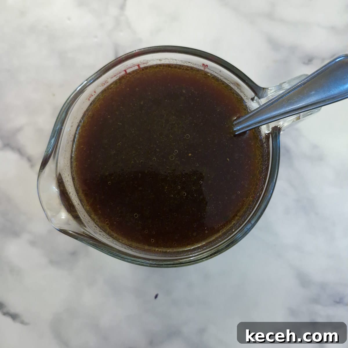 Garlic sauce ingredients combined in a glass jug.