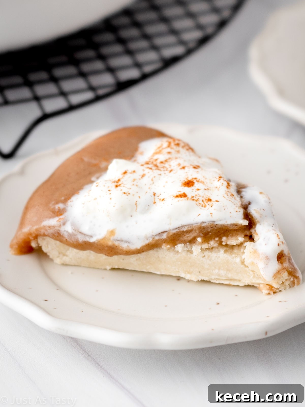 Slice of butterscotch cinnamon pie on a plate.