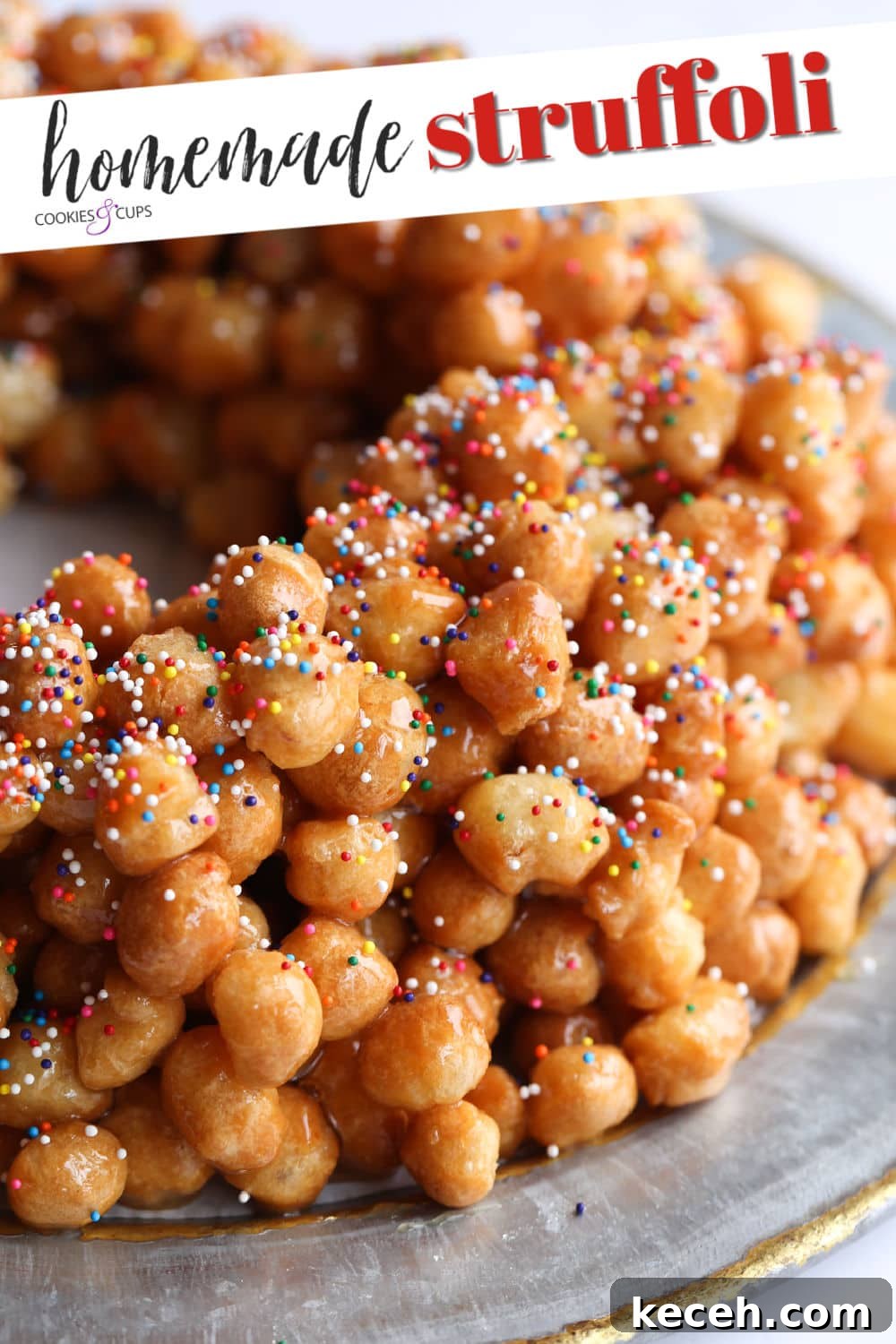 Authentic homemade Struffoli is such a fun Christmas dessert! Cute little balls of fried dough are coated in sweet honey and topped with your favorite holiday sprinkles. They're also called Honey Balls and are a holiday tradition! A Ring of Crispy Fried Dough Balls Coated in Honey and Garnished with Sprinkles