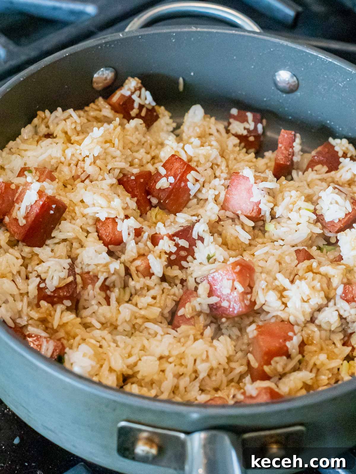 Simple Spam Fried Rice Recipe for Quick Weeknight Meals 11 fried spam and rice in a nonstick pan