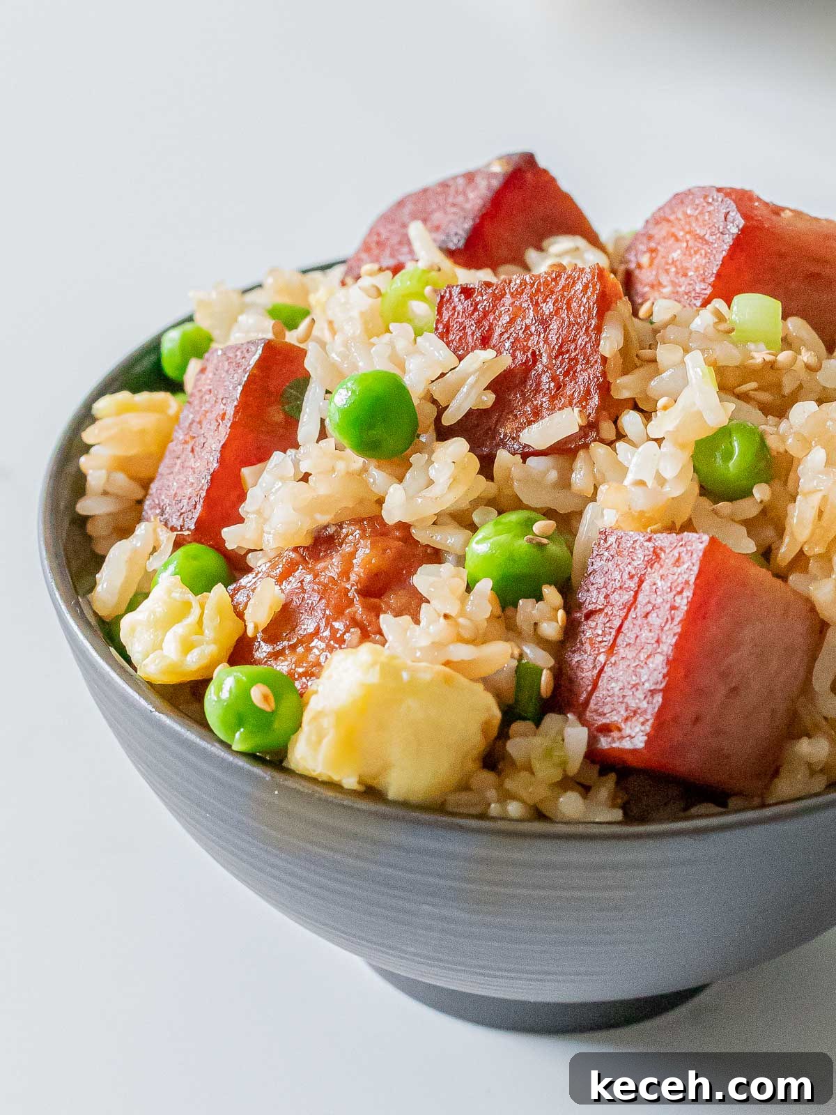 Simple Spam Fried Rice Recipe for Quick Weeknight Meals 15 bowl of spam fried rice with eggs, green peas, and crispy cubes of spam
