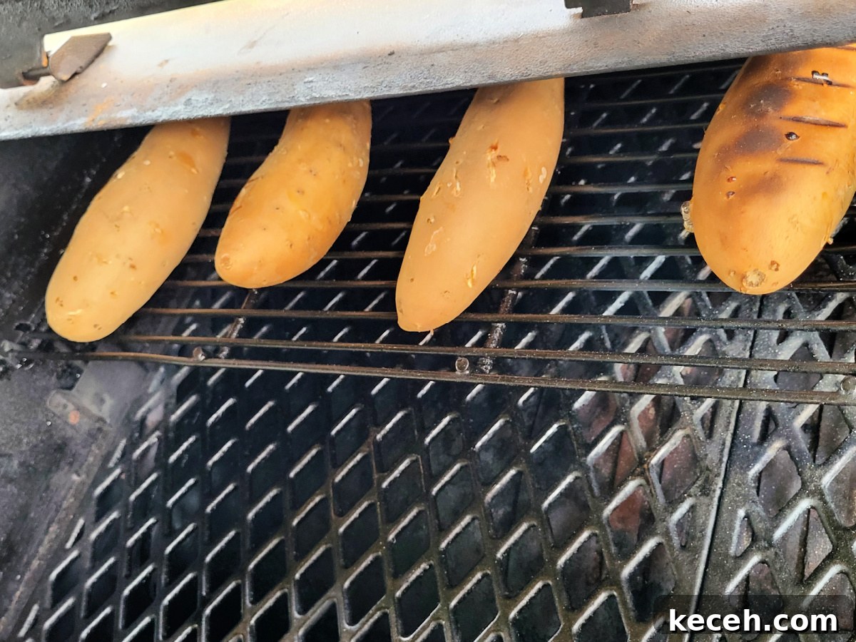 Smoked Sweet Potato Casserole with Maple Pecan Topping 3 sweet potatoes smoking on Pellet Pit Boss Grill