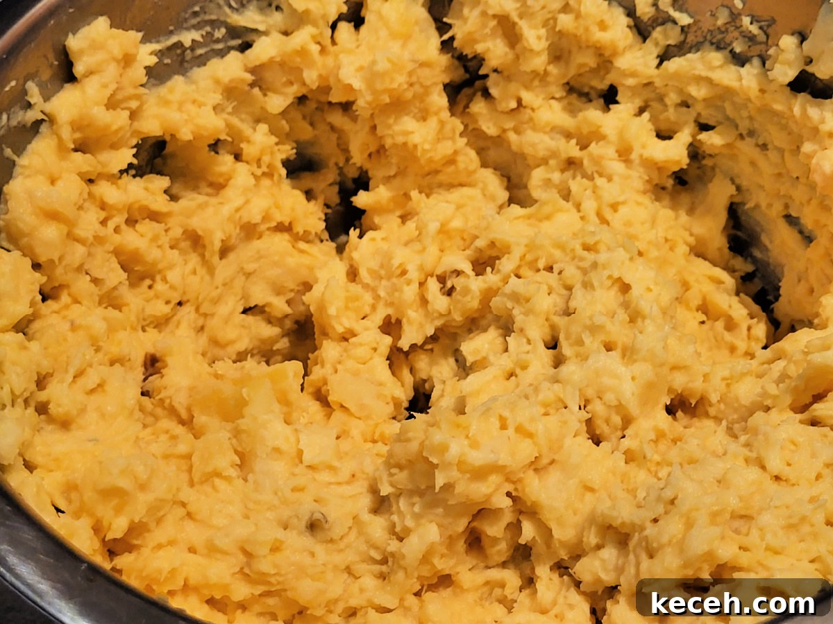 Smoked Sweet Potato Casserole with Maple Pecan Topping 5 Mashed Smoked Sweet Potatoes In Bowl