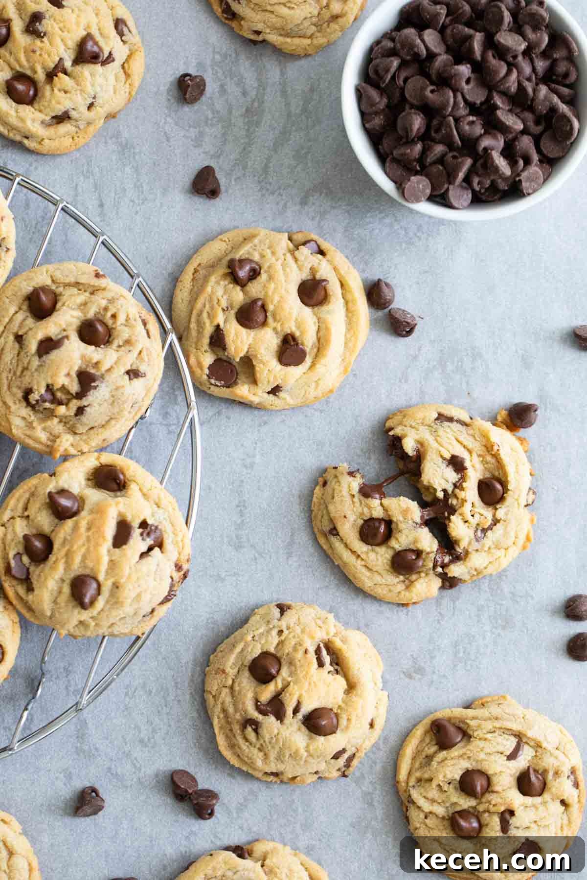 Chewy Chocolate Chip Pudding Cookies Recipe 2 Chocolate chip pudding cookies with a bowl of chocolate chips.