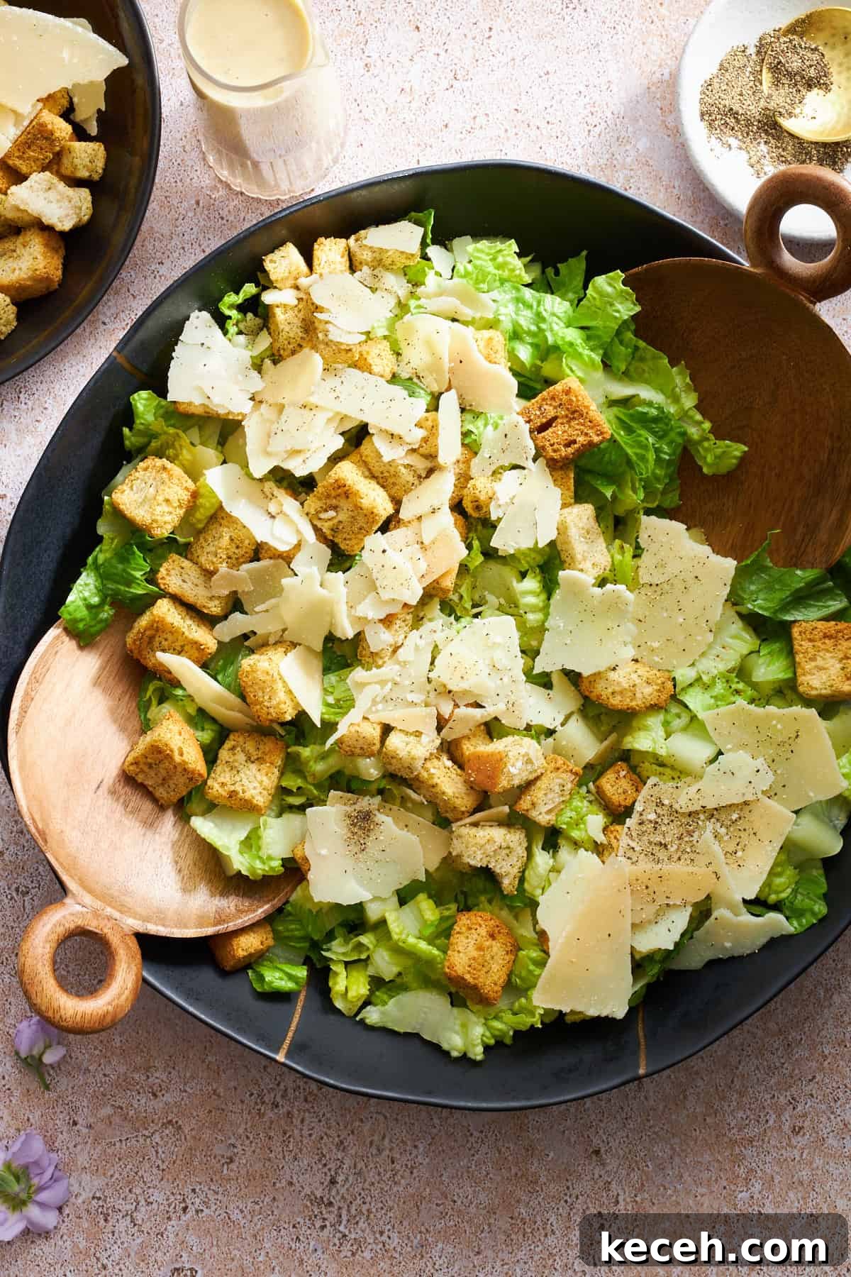 Classic Caesar Salad Recipe with Creamy Homemade Dressing 4 Overhead image of a bowl of Caesar salad without dressing.
