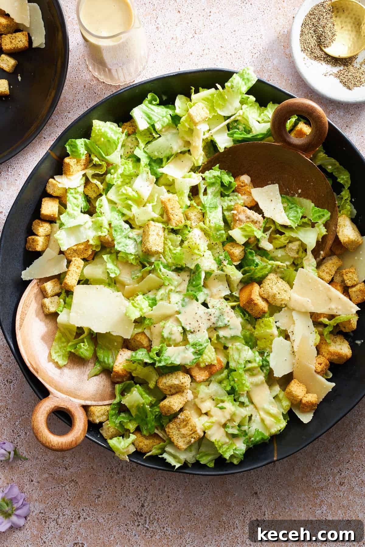 Classic Caesar Salad Recipe with Creamy Homemade Dressing 5 Overhead image of a bowl of Caesar dressing topped with dressing.