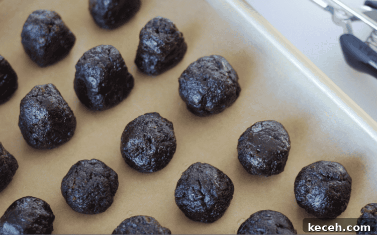 balls of brownie bites on parchment paper