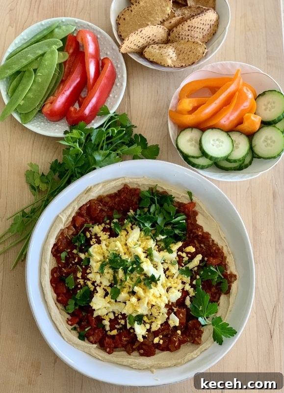Hummus Shakshuka Bowl with Veggies and Sweet Potato Chips 3 Hummus Shakshuka Snack Bowl with Veggies and Sweet Potato Chips via LizsHealthyTable.com