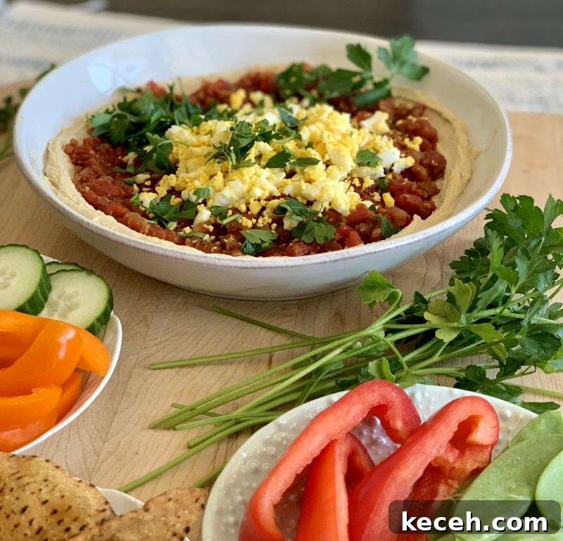 Hummus Shakshuka Bowl with Veggies and Sweet Potato Chips 4 Hummus Shakshuka Snack Bowl with Veggies and Sweet Potato Chips via LizsHealthyTable.com