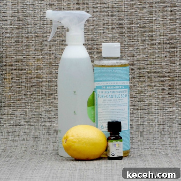 15 Smart Uses for Castile Soap: Home, Cleaning & Personal Care 3 lemon, lemon essential oil bottle, castile soap, and spray bottle