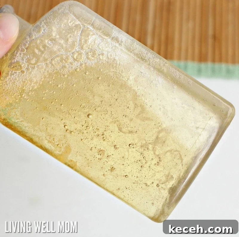 15 Smart Uses for Castile Soap: Home, Cleaning & Personal Care 4 shaking natural body wash mixture in plastic container