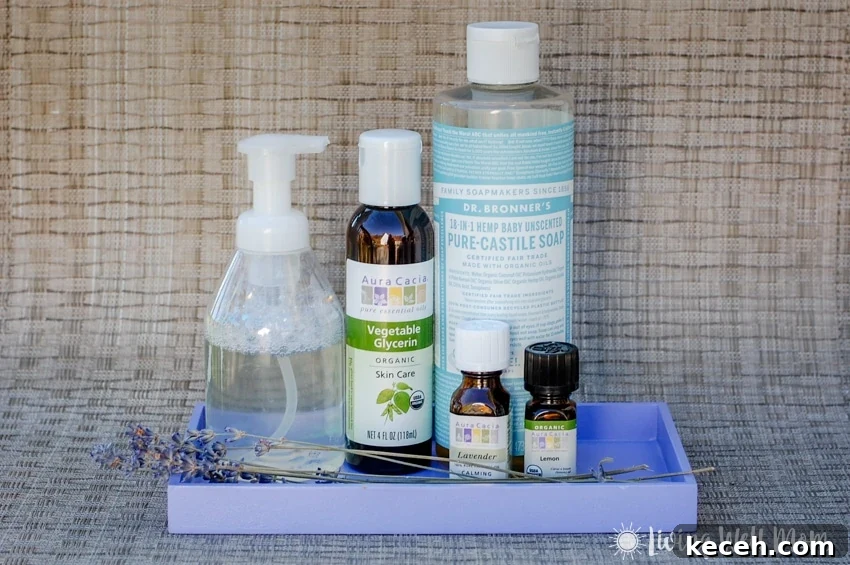 15 Smart Uses for Castile Soap: Home, Cleaning & Personal Care 5 purple tray containing castile soap, foaming handwash dispenser, vegetable glycerin essential oil, lavender essential oil, lemon essential oil