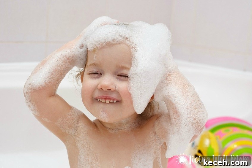 15 Smart Uses for Castile Soap: Home, Cleaning & Personal Care 8 child with shampoo sudsy hair smiling in bathtub