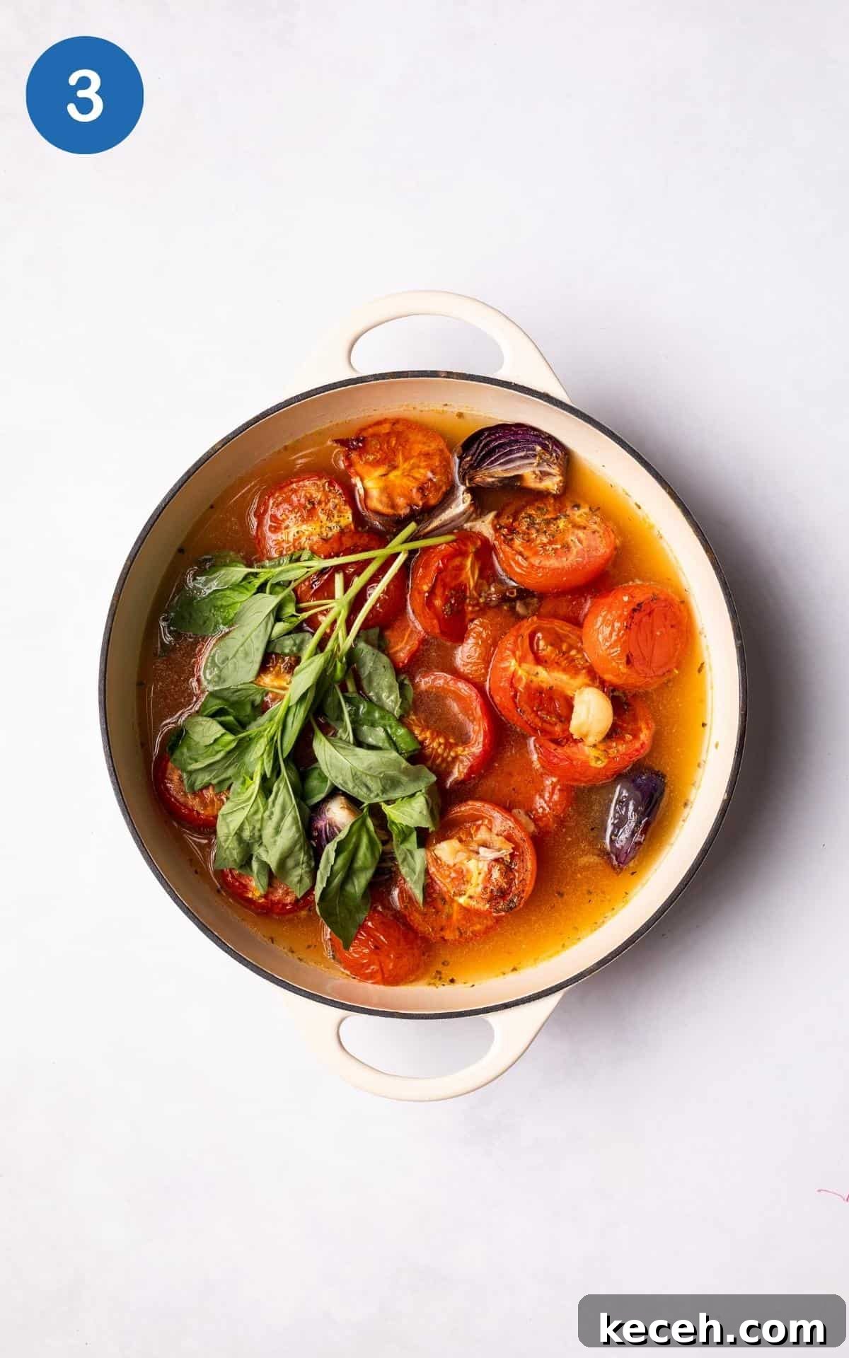 Creamy Roasted Tomato Soup Recipe with Garlic and Basil 6 Tomatoes, basil and vegetable stock in a large pot.