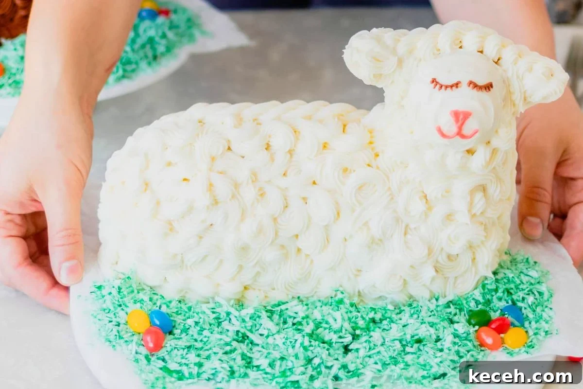 Lamb Cakes at Easter: Cherished Tradition or Baking Disaster? 5 A freshly decorated lamb-shaped cake with fluffy white frosting, set on a bed of green coconut grass and surrounded by colorful candy eggs.