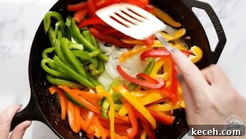 Sauteeing the onions and bell peppers for chicken fajita casserole.