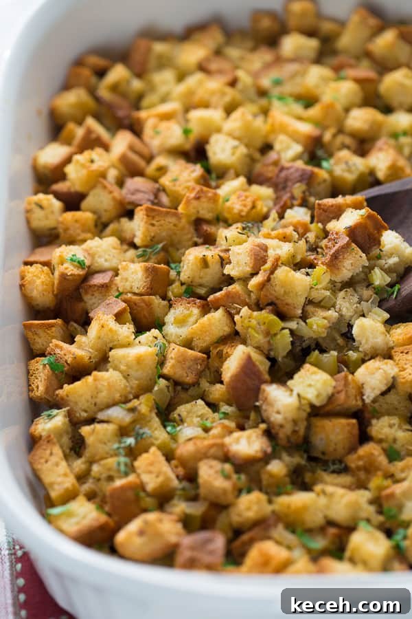 close up shot of stuffing in white casserole dish