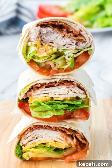 This easy Turkey Ranch Club Wrap is just what your lunch hour needs! Turkey, bacon, and cheese, drizzled with ranch dressing!