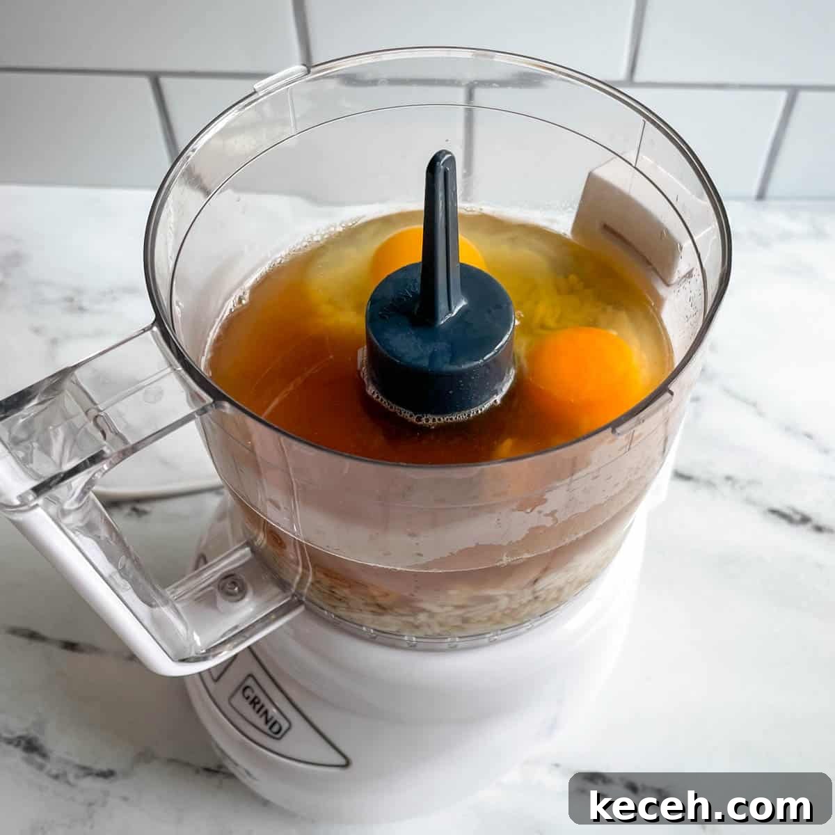 Authentic Greek Chickpea Soup (Revithosoupa) Recipe 10 Eggs, rice, and vegetable broth are pictured in a mini food processor.