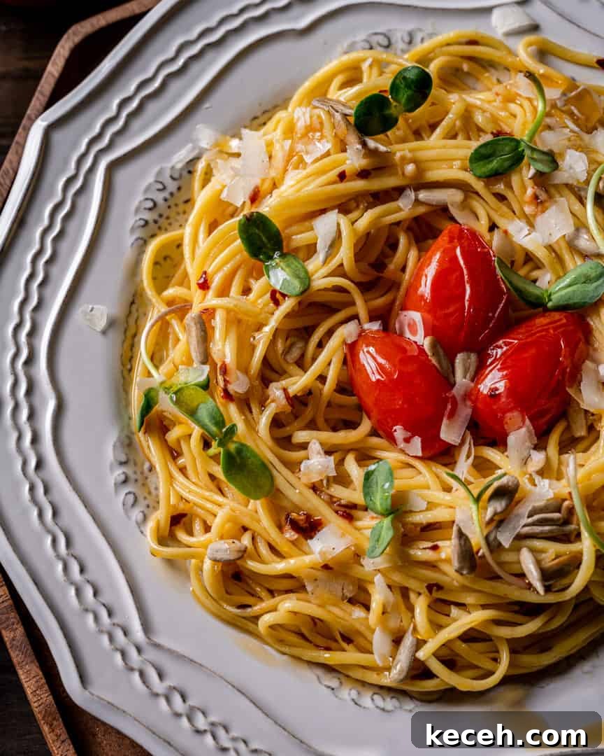 20-Minute Spaghetti Aglio e Olio with Blistered Cherry Tomatoes 4 Spaghetti with Garlic Olive Oil and Chili Peppers with Sunflower Microgreens and Roasted Sunflower Seeds