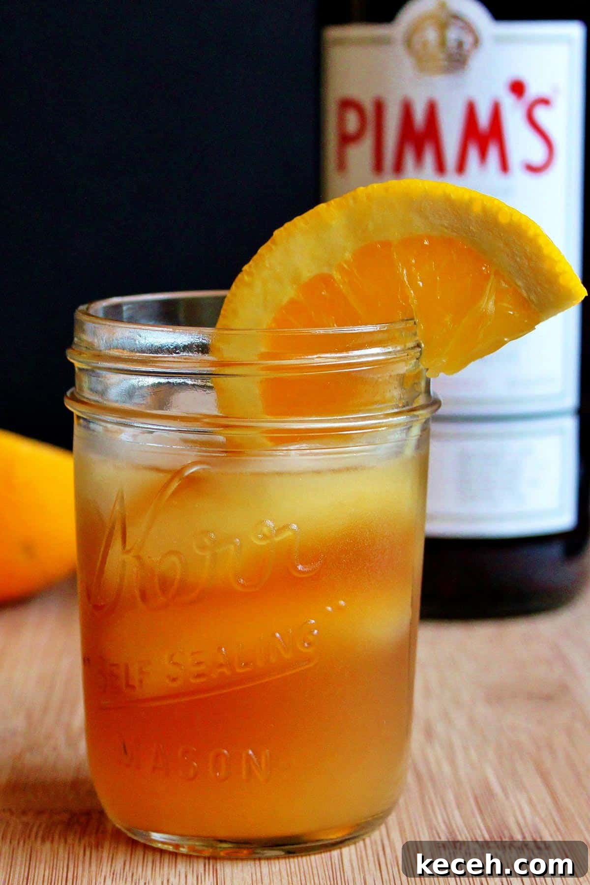 Pimm’s Sundowner Cocktail Recipe: Refreshing Evening Drink 2 A glass of Pimm's sundowner on a cutting board.