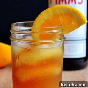 Pimm’s Sundowner Cocktail Recipe: Refreshing Evening Drink 7 A glass of Pimm's sundowner on a cutting board.