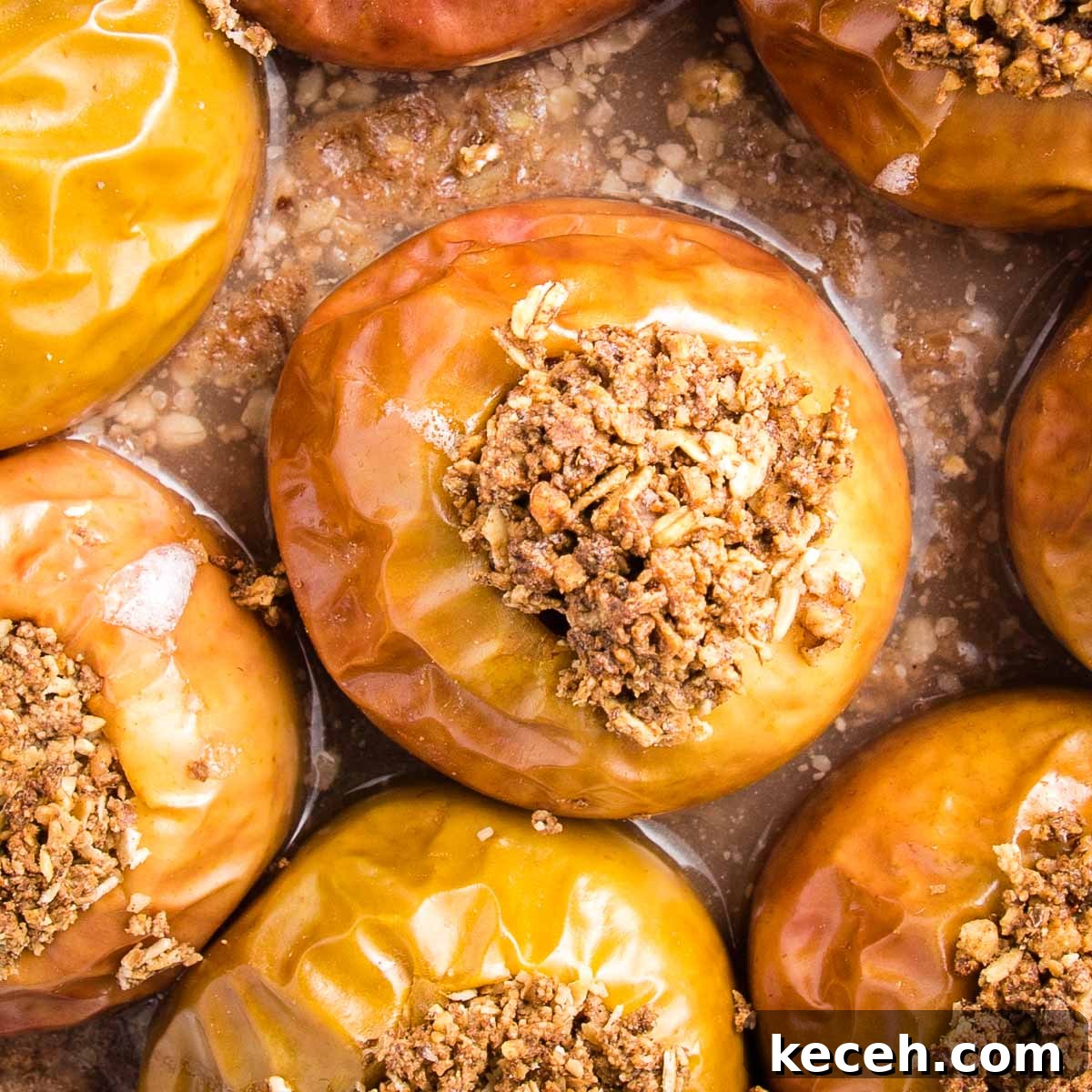 Baked apples in a dish, stuffed with oat and nut mixture.