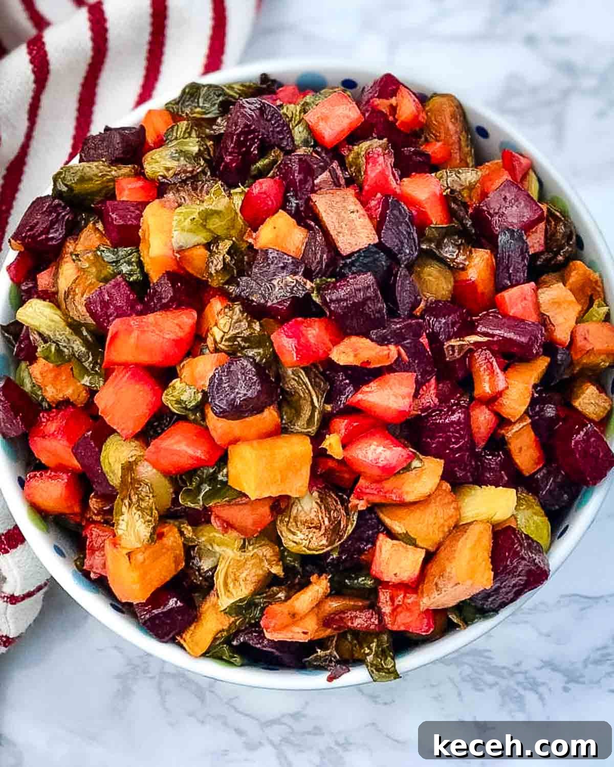 Rosh Hashanah 2026: Festive Recipes and Complete Menu Planner 11 Bowl of roasted, cubed veggies like beets, brussels sprouts, carrots and sweet potatoes.