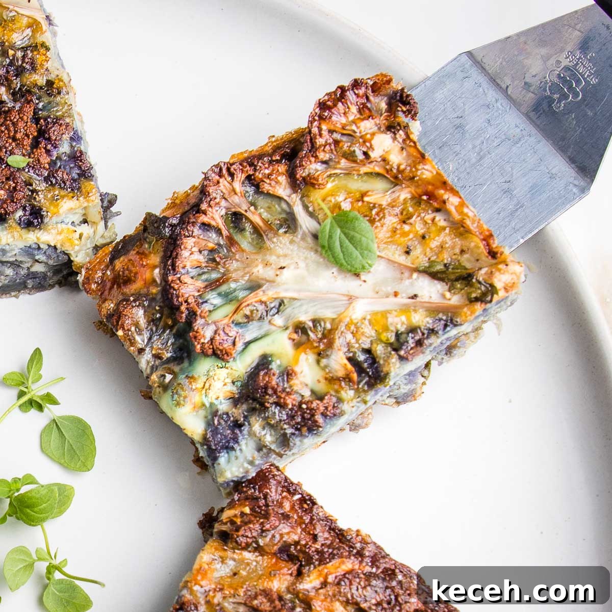 Rosh Hashanah 2026: Festive Recipes and Complete Menu Planner 12 Slice of cauliflower kugel on a plate.