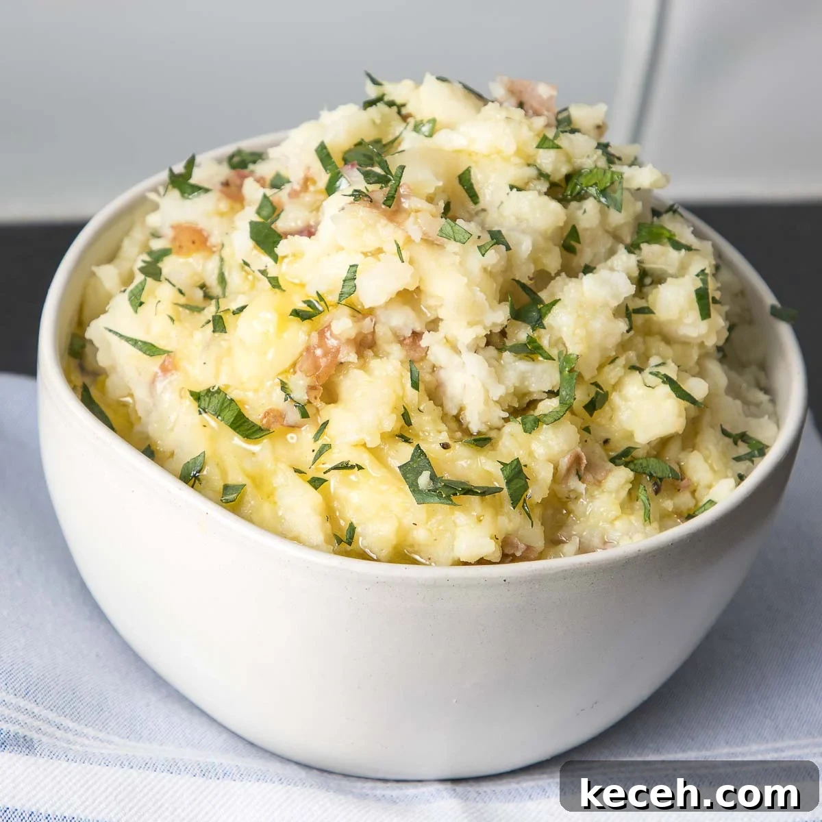 Rosh Hashanah 2026: Festive Recipes and Complete Menu Planner 14 Bowl of mashed potatoes with skins on and sprinkled with fresh parsley.