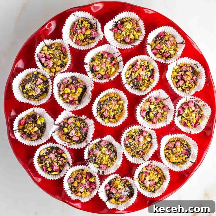 Rosh Hashanah 2026: Festive Recipes and Complete Menu Planner 37 Chocolate peanut butter cups with pomegranate and pistachios.